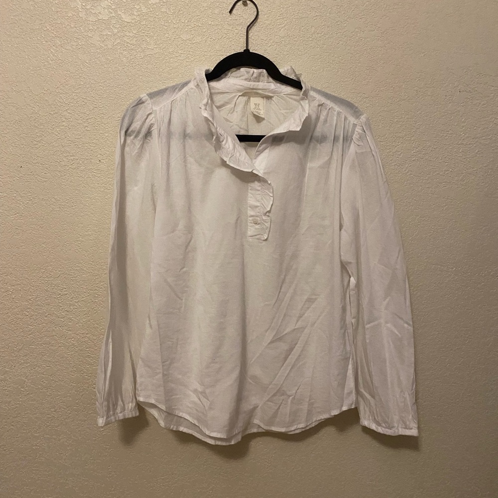 White ruffle blouse